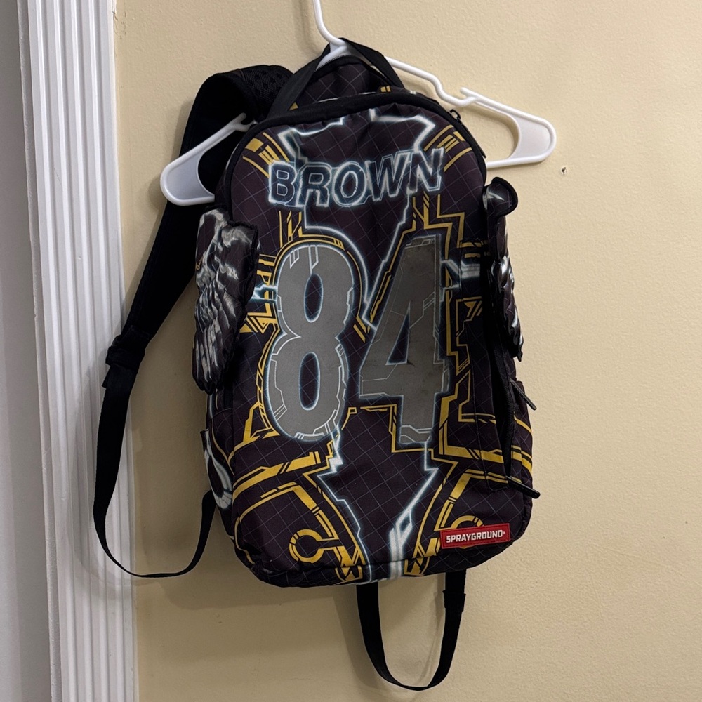 Sprayground Black and Gold Graphic Backpack